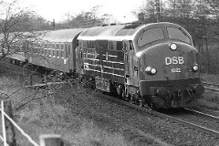 DSB MX 1022 photographed in Fredericia 3. May 1978.  The MX class was built by Nydquist & Holm AB (NOHAB) in Sweden licensed by General Motors. It was based on the MY class, but was bult with a lower axle load for the Danish branch lines. The MX class was put in service in 1960 - 1962. A1A-A1A. Dieselelectric. 1.445 hp. Max speed 133 km/h - 83 mph. Length 18 300 mm. Weight 89 metric tonnes. Built in a number of 45. MX 1022 was put in service in 1961. Withdrawn from service and scrapped in 1990.